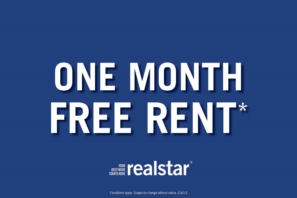 A blue advertisement for a one month free rent offer from Realstar.