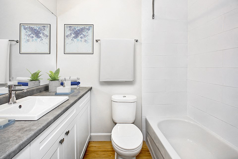 Park Towers Apartments renovated bathroom with extra large vanity and ample storage in 1 bedroom at 55 Carfrae in London, ON