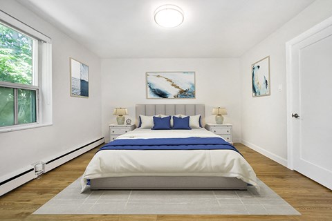 Park Towers Apartments image of bedroom, with window on left side of a renovated 1 bedroom at 55 Carfrae in London, ON