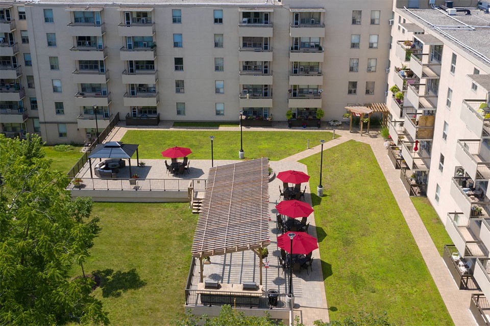 Outdoor patio with seating and gazebos at Prince Court and Princess Manor in Welland, ON