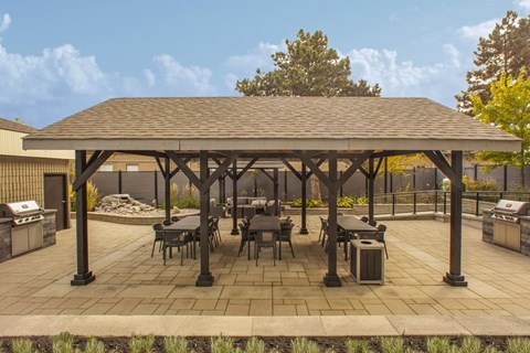 A patio with a gazebo and a table and chairs  at Prince William Apartments in Belleville