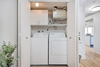 Side-by-side in-suite laundry in a two-bedroom suite at Axial Towers in Chomedey Laval, Quebec