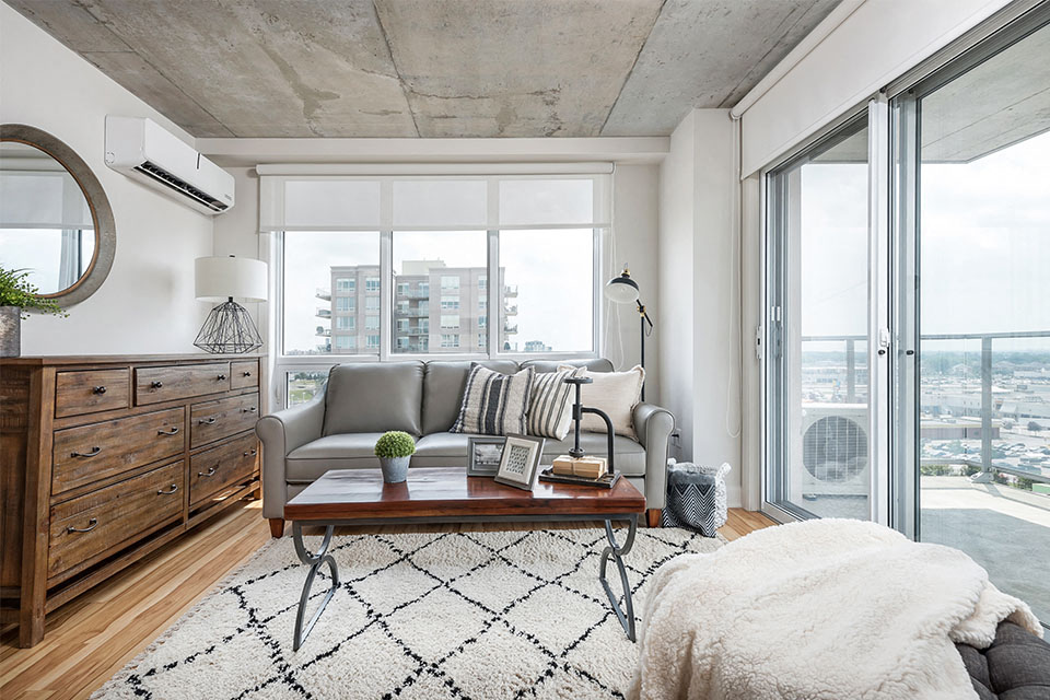 Living room with access to private balcony at Axial Towers