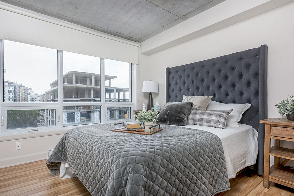 Well lit bedroom at Axial Towers