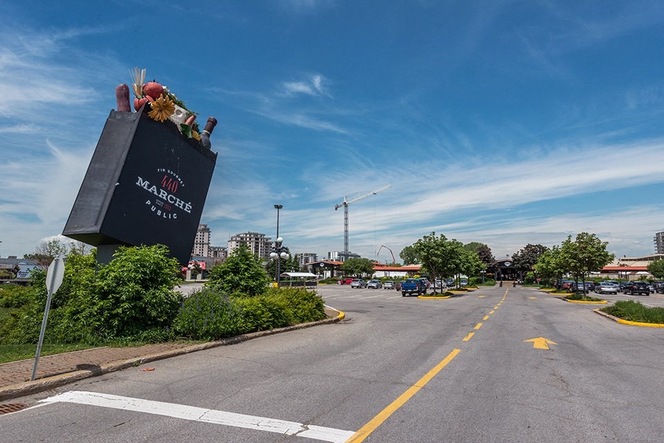 Driveway entrance to Marche 440, a shopping centre and market located next to Axial Towers in Laval