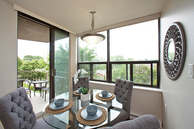 Bright dining area with access to balcony in Whitby, ON