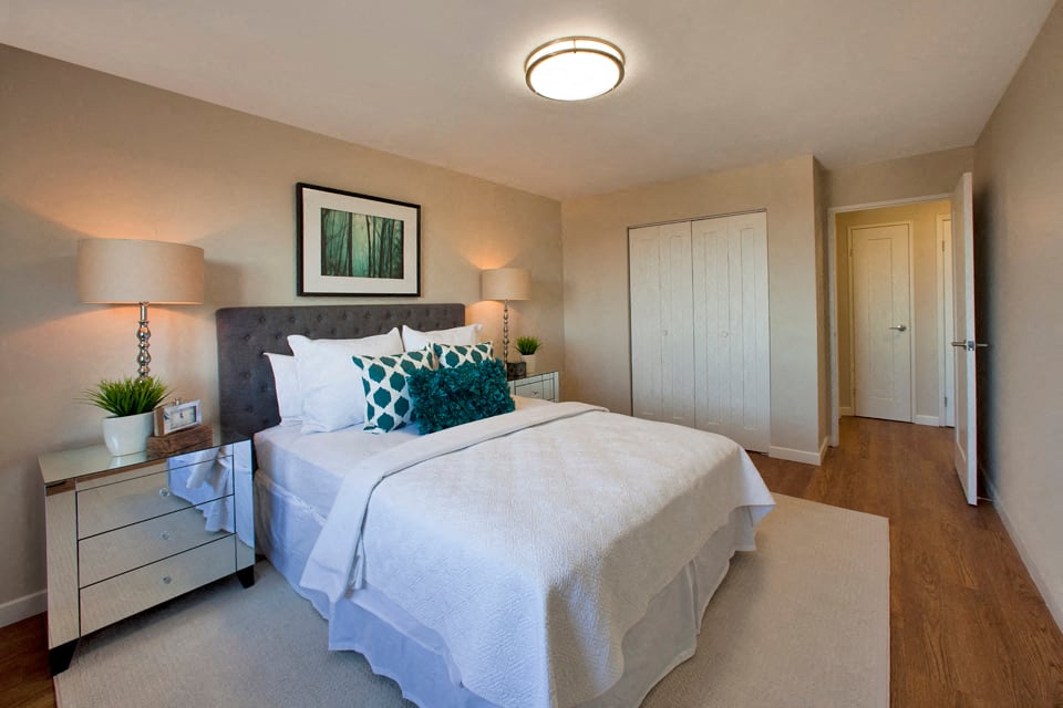 Regency Towers large bedroom with closet and hard surface flooring in St. Catherines, ON