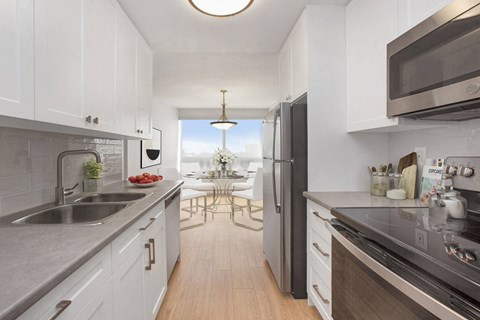 Kitchen with premium cabinetry and stainless steel appliances at Riverbend Tower Apartments in Chatham, ON