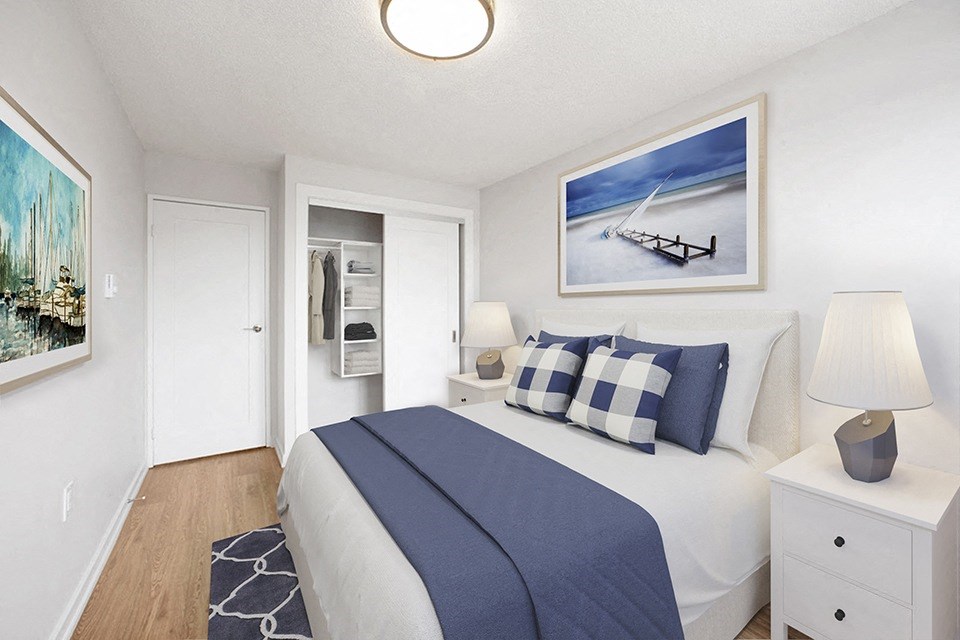 Primary bedroom, looking towards closet with built in storage, at Riverbend Tower Apartments in Chatman, OM