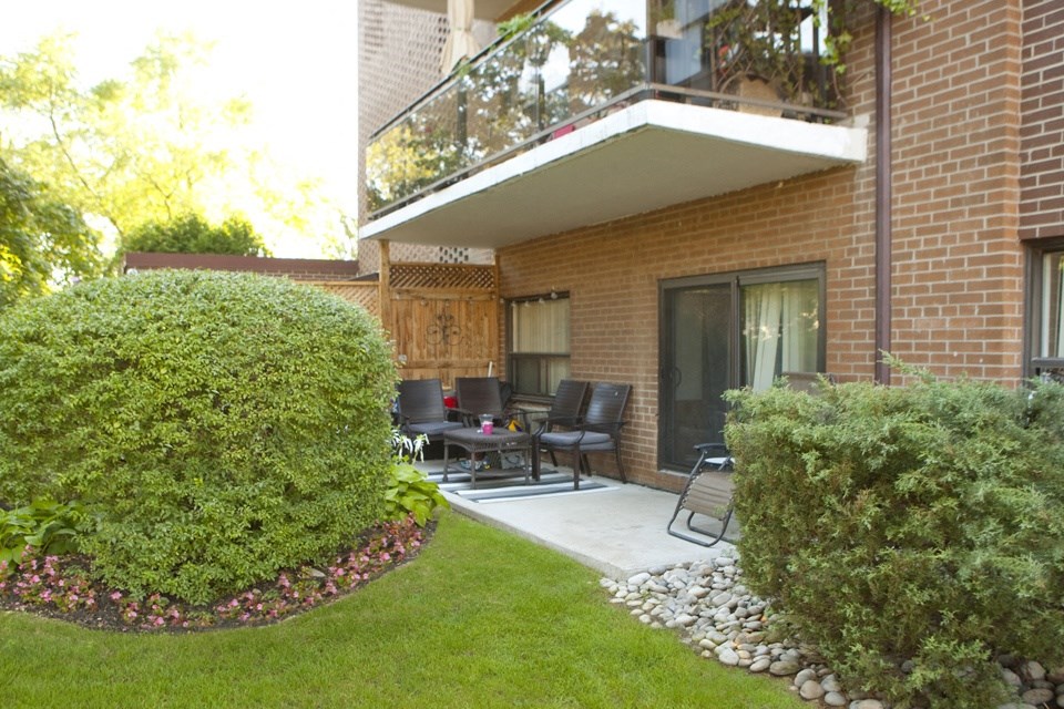 Rockliffe Park Suites building exterior featuring walk-out terrace and balcony in Oakville, ON