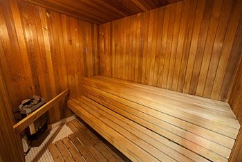 a wooden sauna with a wooden bench