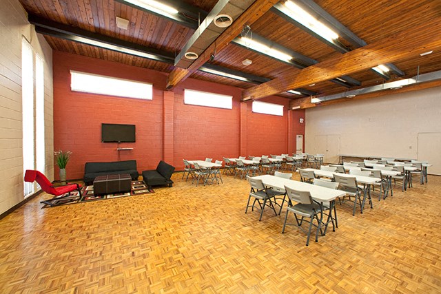 St. Lawrence Village in St. Catharines, ON Large social room for events with tables and chairs