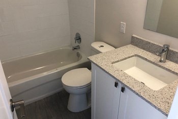 San Remo/Monaco in Toronto, ON bathroom with full sized bathtub, modern cabinetry and countertop - Photo Gallery 4