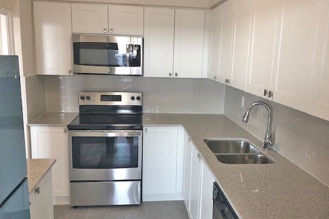 San Remo/Monaco in Toronto, ON kitchen with stainless steel appliances