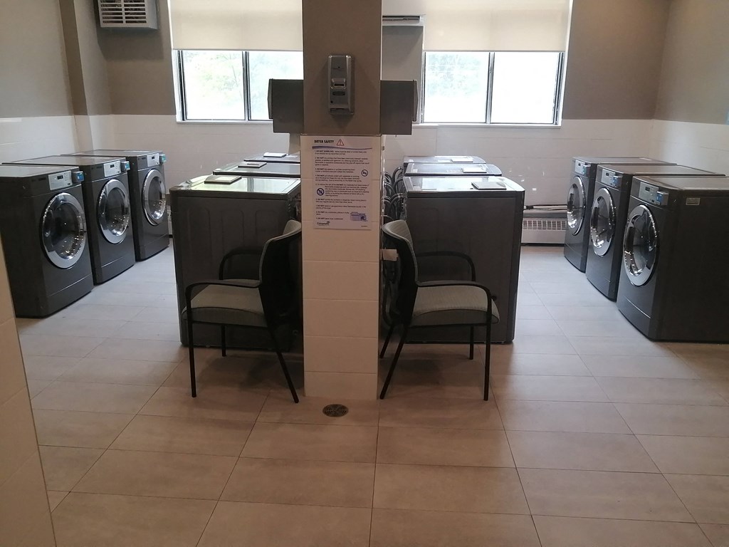 a row of washing machines in a laundromat