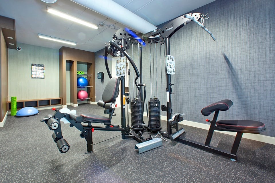 Springbank Apartments in London, ON gym with weight lifting machine