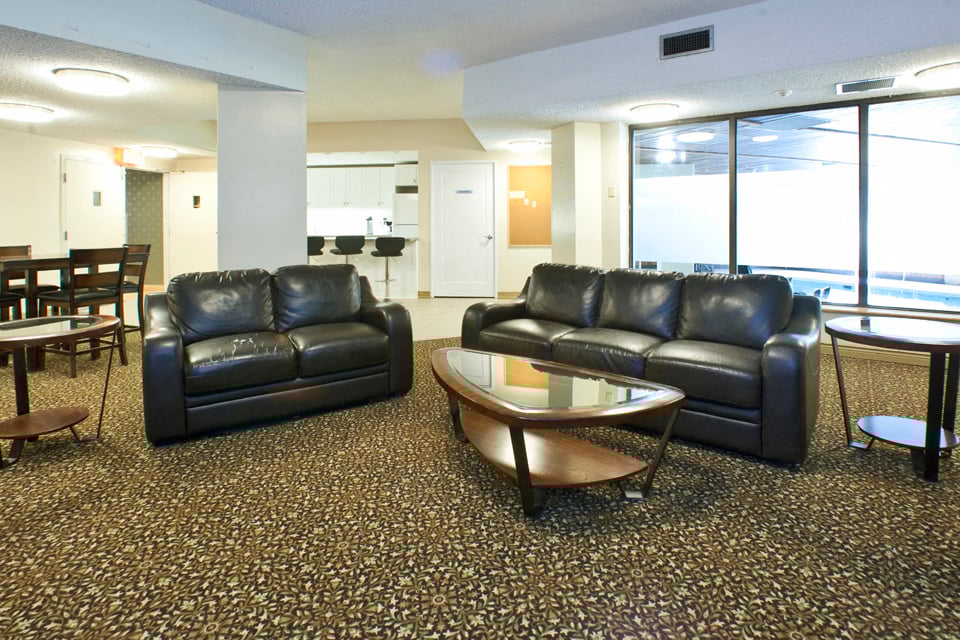 Springbank Apartments social room with couches in London, ON