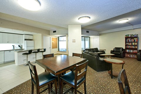 Springbank Apartments social room with dining table and full kitchen in London, ON