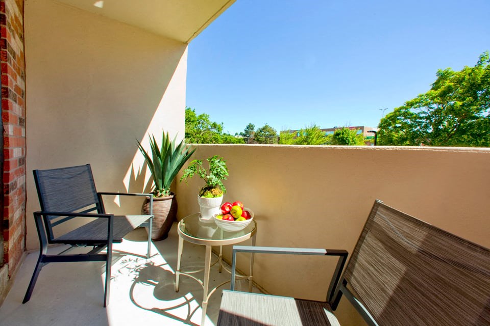 Sunnidale Place Balcony with view over the trees and a bright blue sky in Barrie, ON