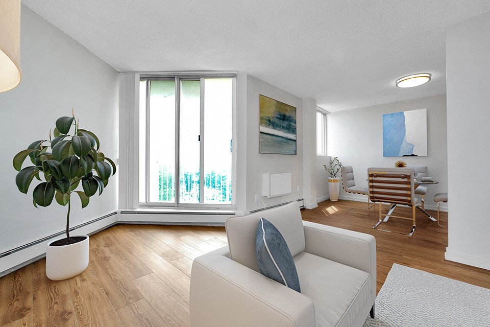 Sunset Towers living and dining room looking towards balcony with sliding glass door in St. Thomas, ON