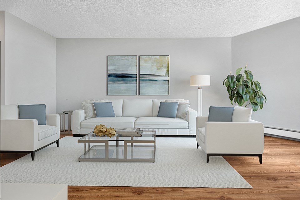 Sunset Towers living room with three-seater couch, two armchairs and coffee table in St. Thomas ON