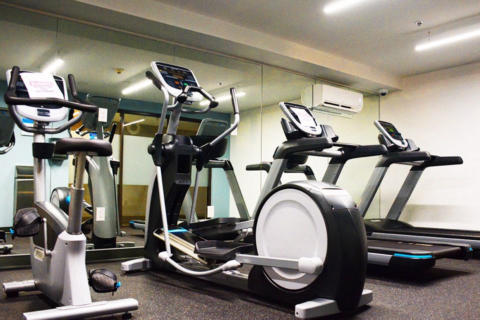 Fitness center with cardio machines at Surrey Village in Surrey, BC
