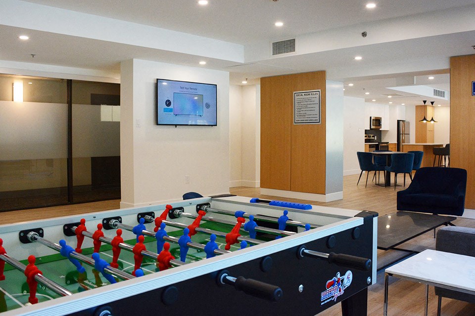 Surrey Village social room lounge seating and fooseball table in Surrey, BC