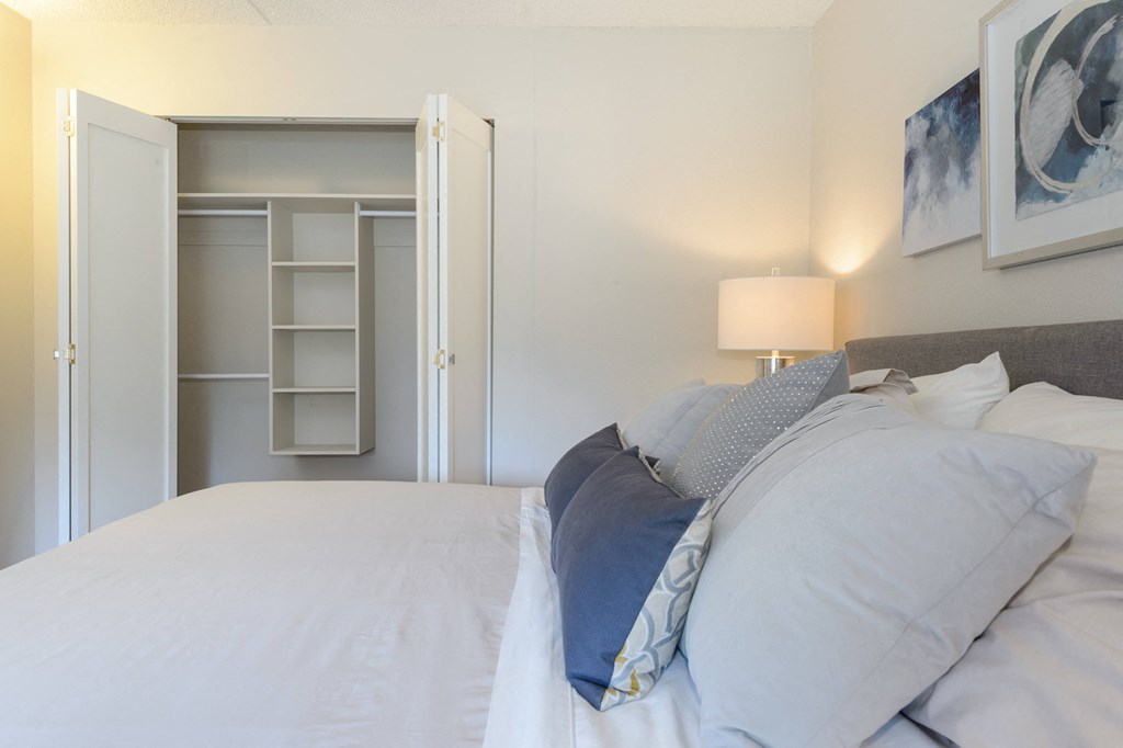 a bedroom with a large closet at Surrey Village in Surrey BC