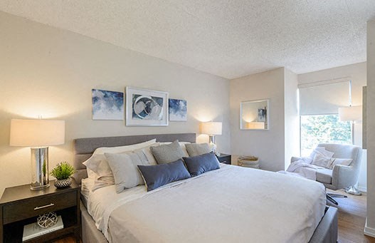 Surrey Village in Surrey, BC spacious bedroom with large window