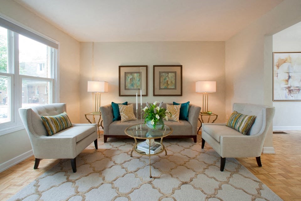 Tamarack Woods Stylish living room with couch and two single seat plush chairs in Barrie, ON