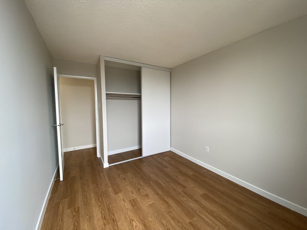 Second bedroom in a two bedroom apartment looking towards closet at Tarawood Place in Peterborough, ON