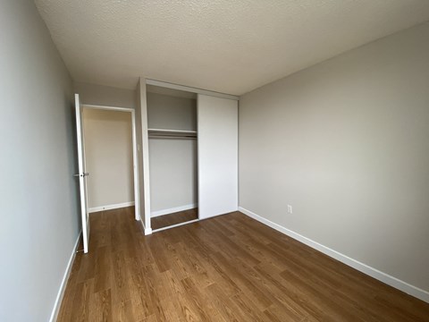 Second bedroom in a two bedroom apartment looking towards closet at Tarawood Place in Peterborough, ON