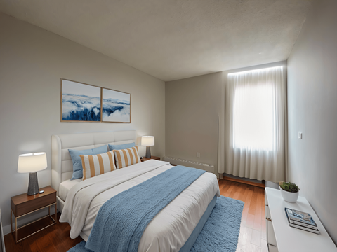 A bedroom with a large bed and a window in Peterborough ON