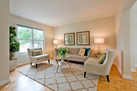 a living room with a couch and chairs