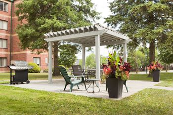 Testa Heights Apartments in Uxbridge, ON Patio lounge area with gazebo and BBQ