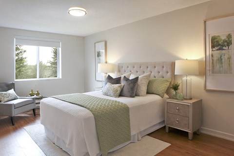 Testa Heights Apartments in Uxbridge, ON Master Bedroom featuring hard surface flooring, ceiling light and window with roller blinds included