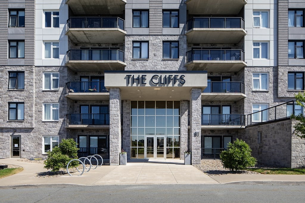 an apartment building with the cliffs sign on the front of it