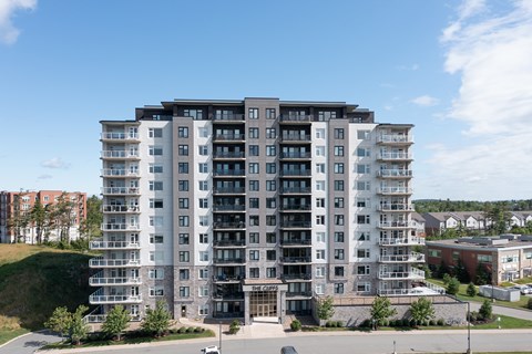 an aerial view of an apartment building on a sunny day