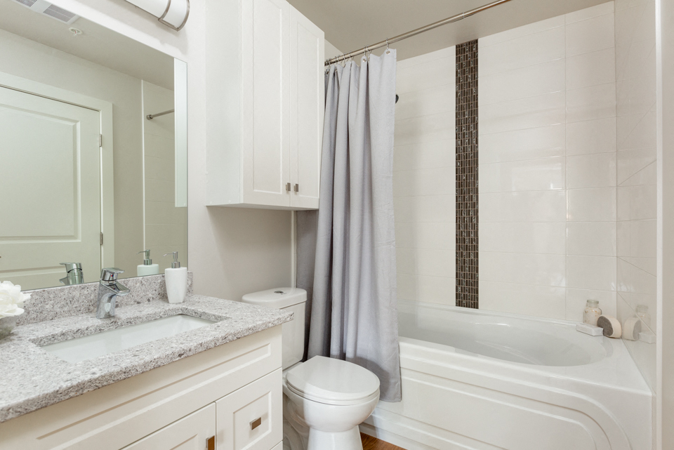 The Conservatory modern bathroom with full size bathtub in Kelowna, BC