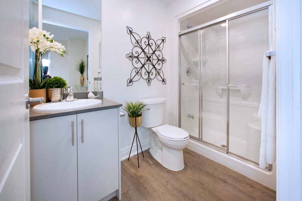 The Miltonian Apartments bathroom featuring walk-in shower in Milton, ON