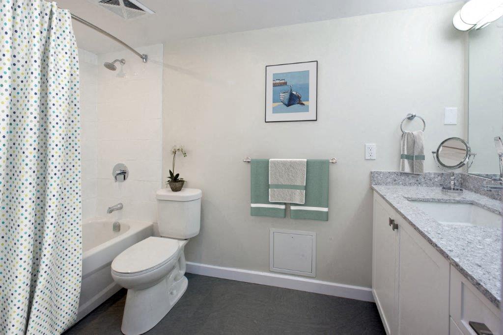 The Parkwood modern bathroom with full size bathtub in Bellville, ON