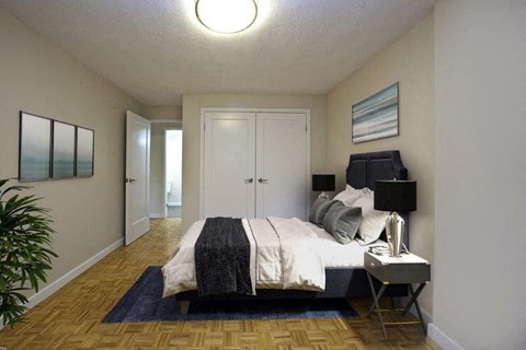 The Parkwood bedroom with large closet and hardwood flooring in Bellville, ON