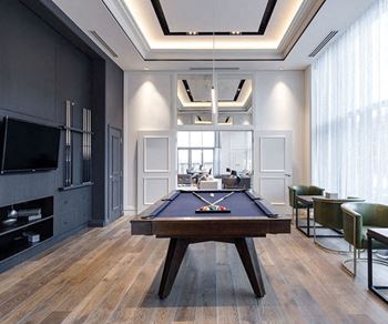 The Taunton Apartments billiards room featuring flat screen TV and pool table in Oakville, ON