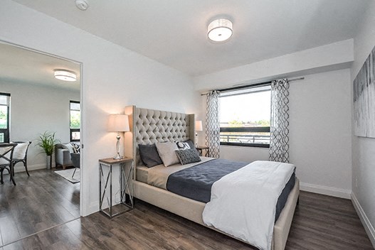 Trio On Belmont bedroom with luxury plank flooring in Kitchener, ON