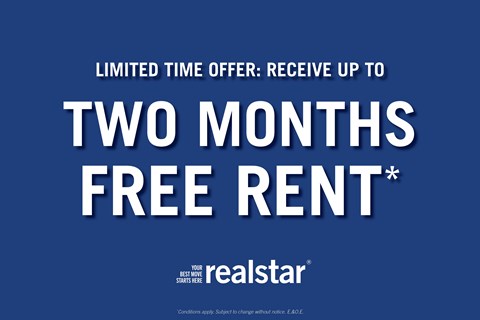 A blue advertisement for a limited time offer of up to two months free rent from Realstar.