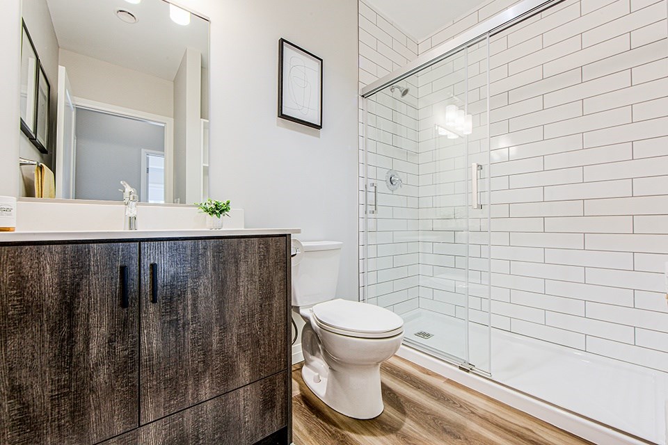 Main bathroom with a walk-in shower in a 2 bedroom 2 bathroom Variation C floor plan at Vale Station Apartments in Waterloo, Ontario