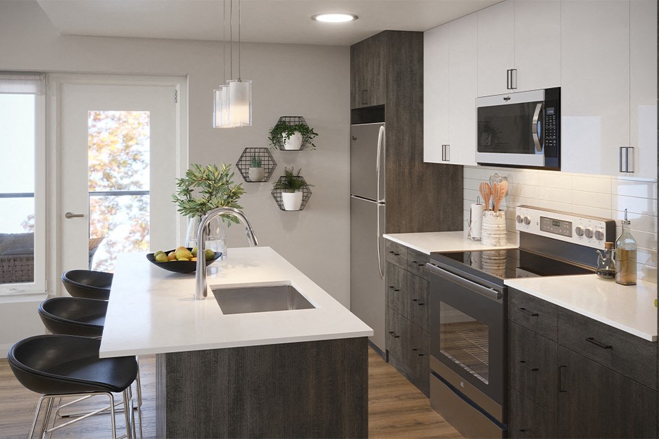 Kitchen with stainless steel appliances at Vale Station Apartments in Waterloo ON