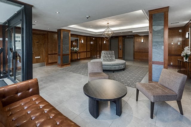 Victoria Place lobby with multiple seating areas in Saskatoon, SK