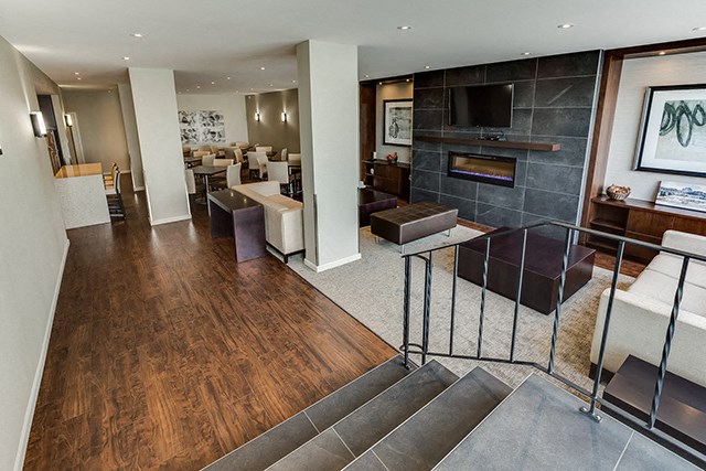 Victoria Place staircase leading into modern social room in Saskatoon, SK