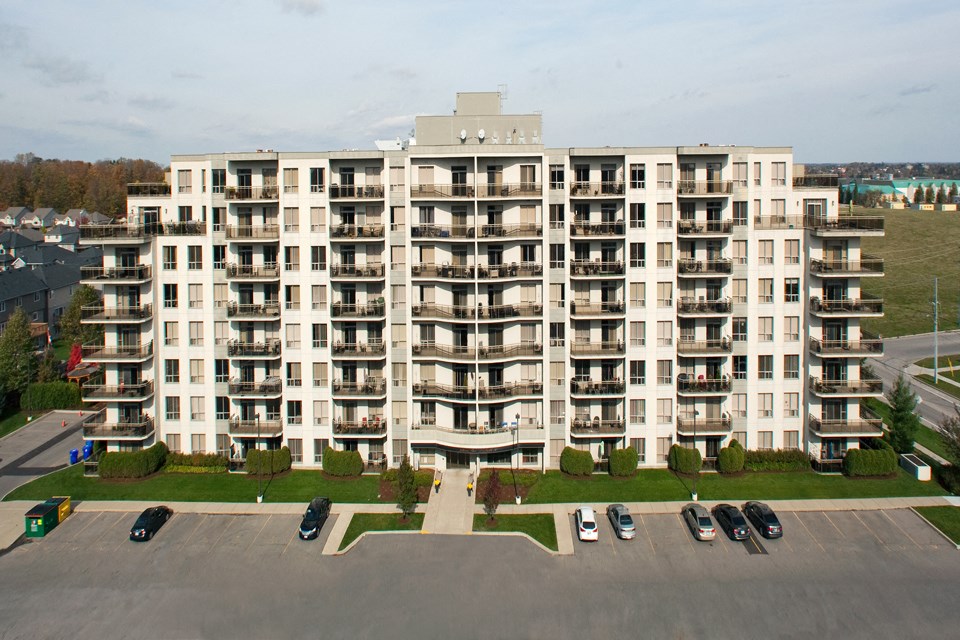 Juliana Place Apartments building exterior with parking in Woodstock, ON
